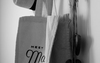 Wallpaper A Hat and a Bag Hanging on a Wall