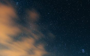Wallpaper The Night Sky with Stars and Clouds