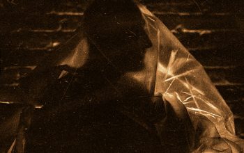 Wallpaper A Black and White Photo of a Person Holding an Umbrella