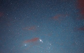 Wallpaper A Night Sky Filled with Stars and Clouds