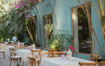 Wallpaper An Outdoor Dining Area with Tables and Chairs