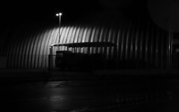 Wallpaper A Bus Shelter Illuminated in the Darkness
