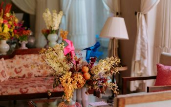 Wallpaper A Room Decorated with Flowers and Furniture