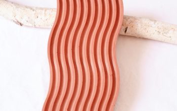 Wallpaper A Pink, Wavy Soap Dish with Decor