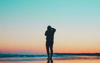 Wallpaper Silhouette of Person on Seashore