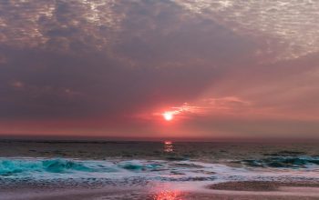 Wallpaper Beach Under Cloudy Sunset