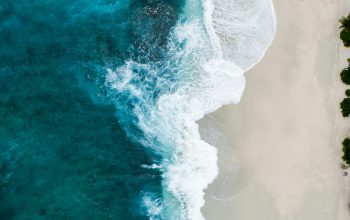 Wallpaper Aerial Photography of Large Body of Water and Shoreline