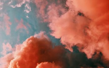 Wallpaper Orange Smoke on Blue Background