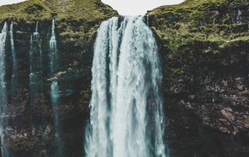 Wallpaper Group of People Standing Near Waterfalls