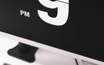 Wallpaper Flat Screen Monitor Displaying 9 PM