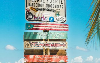 Wallpaper Peligro Warning Signage on Beach