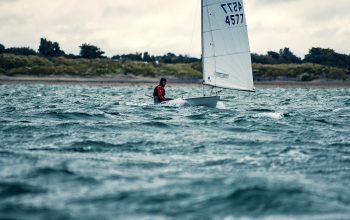 Wallpaper Man Riding Sailboat During Day