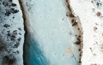 Wallpaper Aerial Photography of River Beside Snow Field