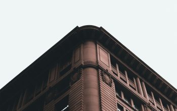 Wallpaper A Tall Building with a Clock