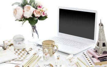 Wallpaper Laptop Computer Surrounded by Assorted Items