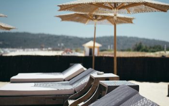 Wallpaper White Outdoor Lounges with Umbrellas