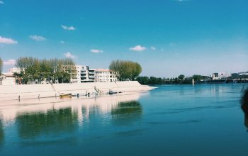 Wallpaper White Concrete Building Near Body of Water During Daytime