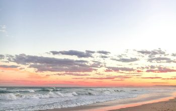 Wallpaper Gray Sand Beside Body of Water at Golden Hour