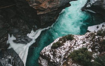 Wallpaper River Flows Between Rock Formation