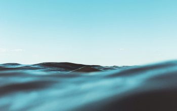 Wallpaper Blue and White Sky Over the Sea