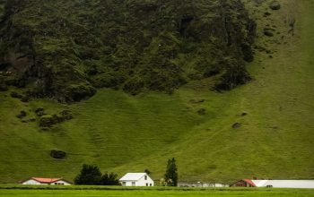 Wallpaper White and Red House on Green Grass Field near Mountain