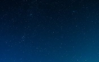 Wallpaper Silhouette of Buildings Under a Night Sky