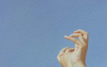 Wallpaper Person’s Hand on Blue Sky