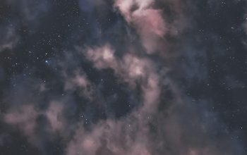 Wallpaper The Night Sky is Filled with Stars and Clouds