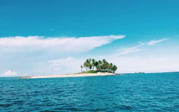 Wallpaper Green Trees on Island Surrounded by Sea Water Under Blue Sky