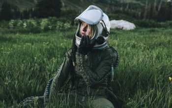 Wallpaper Man in Black Jacket, White Helmet, Green Grass