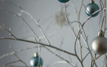 Wallpaper Blue and White Baubles on Tree Branch