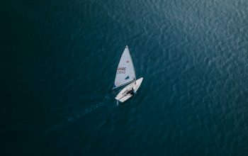 Wallpaper White Boat on Blue Sea During Daytime