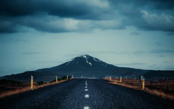 Wallpaper Gray Concrete Road Between Brown Grass Field Under White Clouds and Blue Sky