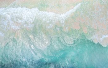 Wallpaper Surfer Riding Ocean Waves