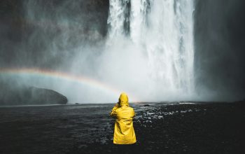 Wallpaper Person in Yellow Hoodie at Waterfall