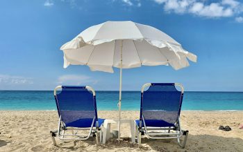 Wallpaper Blue and White Chair Under White Umbrella on Beach