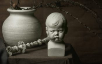 Wallpaper White Ceramic Figurine on Blue Textile