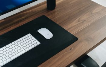Wallpaper Silver Apple Keyboard on Brown Wooden Desk