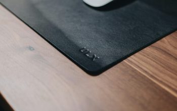 Wallpaper White Apple Magic Mouse on Black Mouse Pad