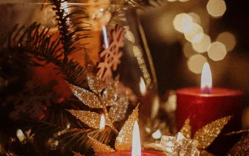 Wallpaper A Table Topped with Candles and Christmas Decorations