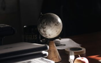 Wallpaper A Desk with a Computer and Globe