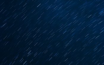 Wallpaper A Night Sky with Stars and a Plane