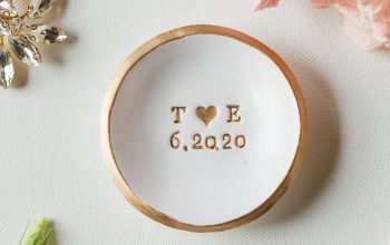 Wallpaper A White Bowl with the Word Toe on It Next to Flowers