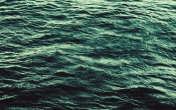 Wallpaper A Body of Water with Waves
