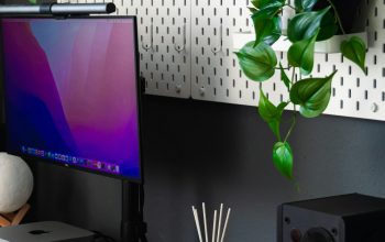 Wallpaper A Desk with a Computer and Speakers