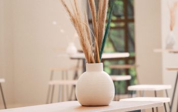 Wallpaper A Table with a Vase and Plant
