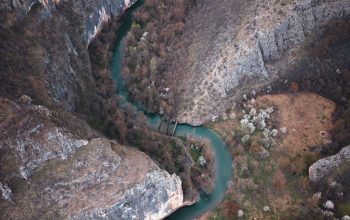 Wallpaper An Aerial View of a River Running Through a Canyon