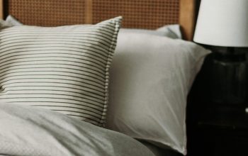 Wallpaper A Wooden Headboard Bed with Pillows
