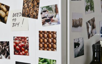 Wallpaper A Refrigerator with Magnets and Pictures