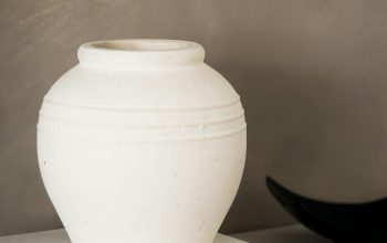 Wallpaper A White Vase on a White Block
